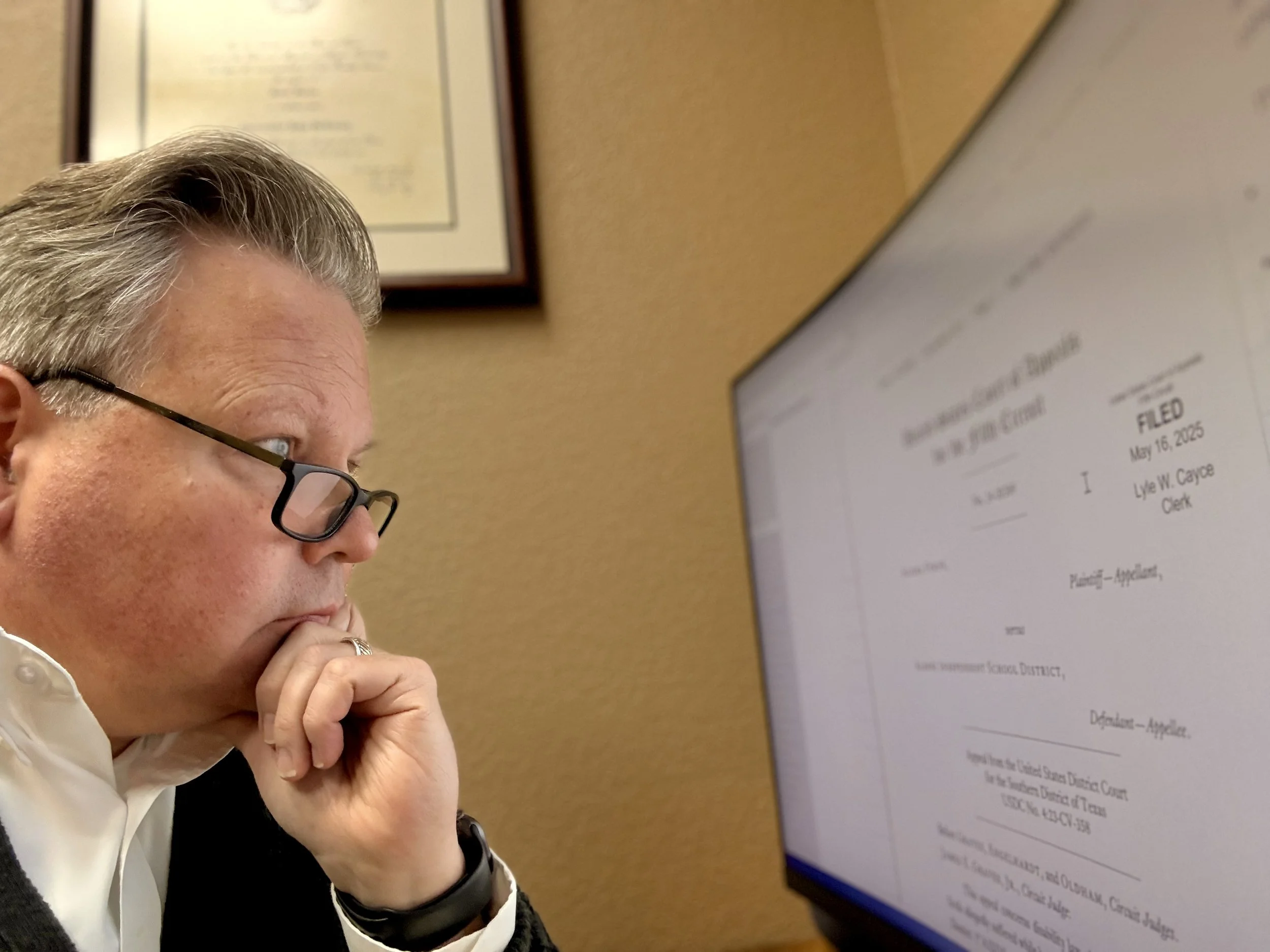 Attorney Chris McKinney reviewing a Fifth Circuit Court of Appeals opinion